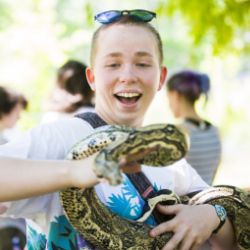 Emory student holding a snake